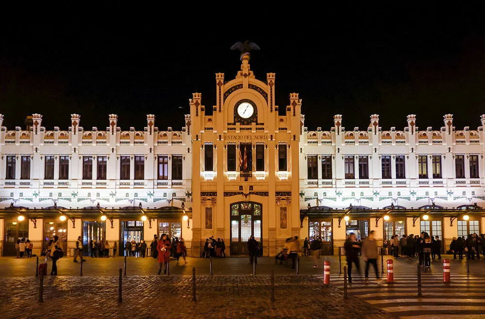 Modernist fa&ccedil;ade of the North Railway Station in Valencia at night - Things to do in Valencia, Spain