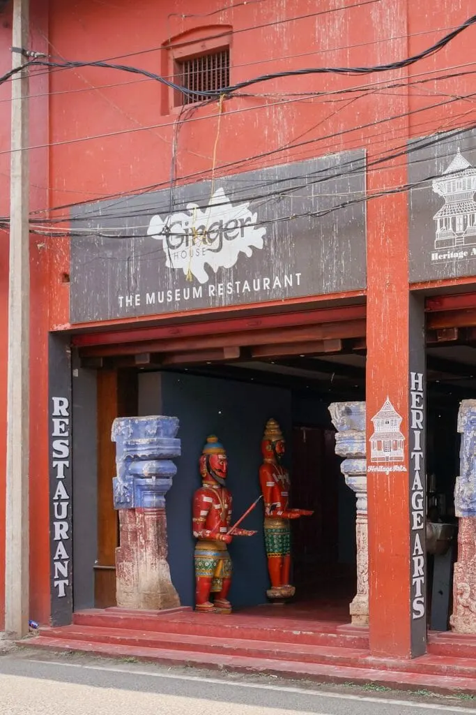 The entrance to Ginger House Cafe in Kochi is through an antique dealer