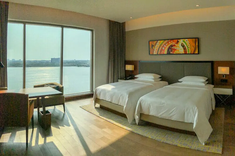 Twin room at the Grand Hyatt Kochi Bolgatty Hotel with views over the water