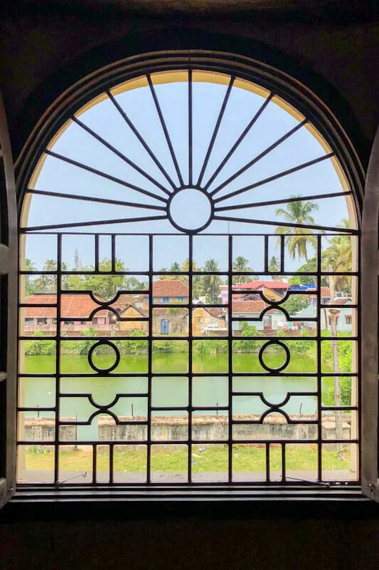 Arched window with decorated grills at Mattancherry Palace