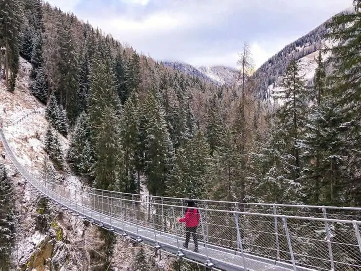 Visiting the Rigaiolo suspension bridge is one of the things to do in Trentino in winter
