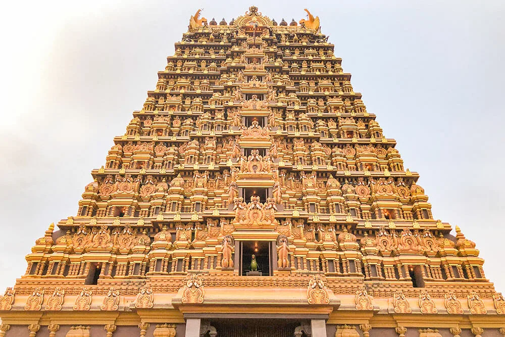 Elaborate golden HIndu temple tower gate