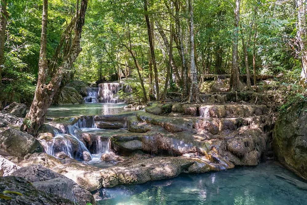 Turquoise tiered pools at Erawan Waterfalls, Kanchanaburi, a top nature stop on this Thailand tour
