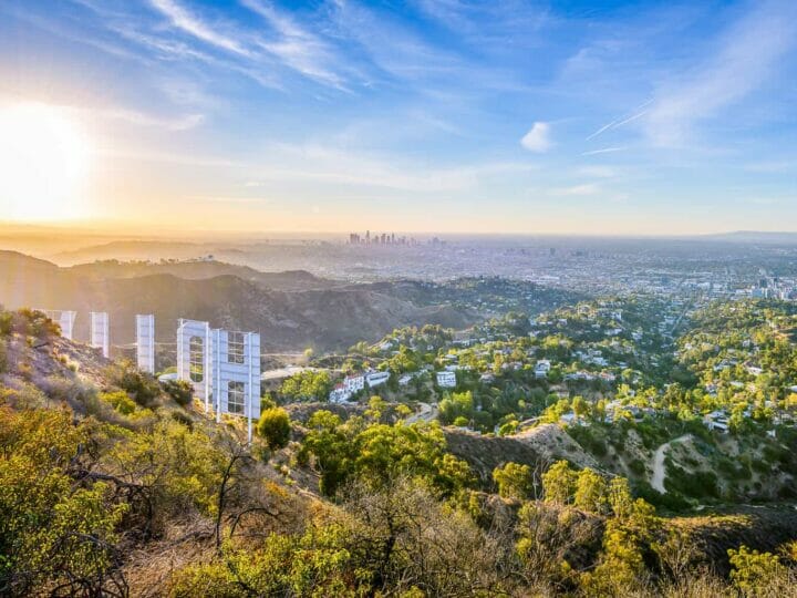 View of Los Angeles from the top of the hill with part of the back of the Hollywood sign visible
